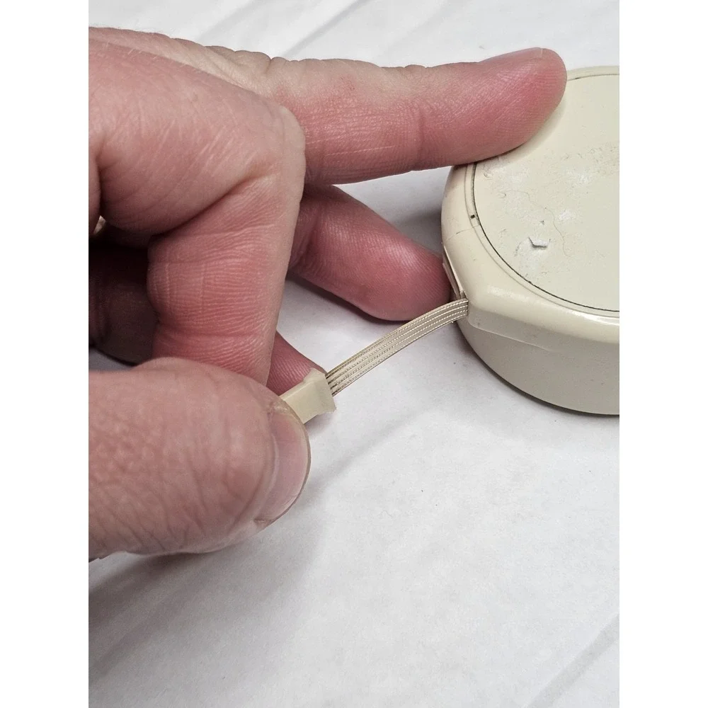 Vintage CORD-Minder Telephone Line Cord Retractor by Presco Beige